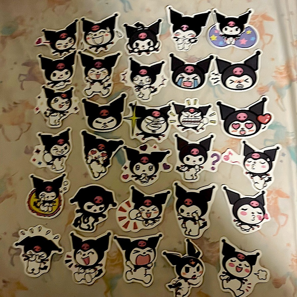 am selling kuromi stickers there is going to be 30 stickers its black pink white